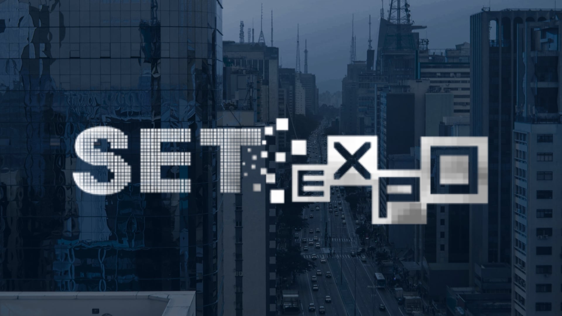 Dark blue-toned city skyline with high-rise office buildings and a busy avenue in the background, overlaid with the white ‘SET Expo’ logo in a pixelated digital style